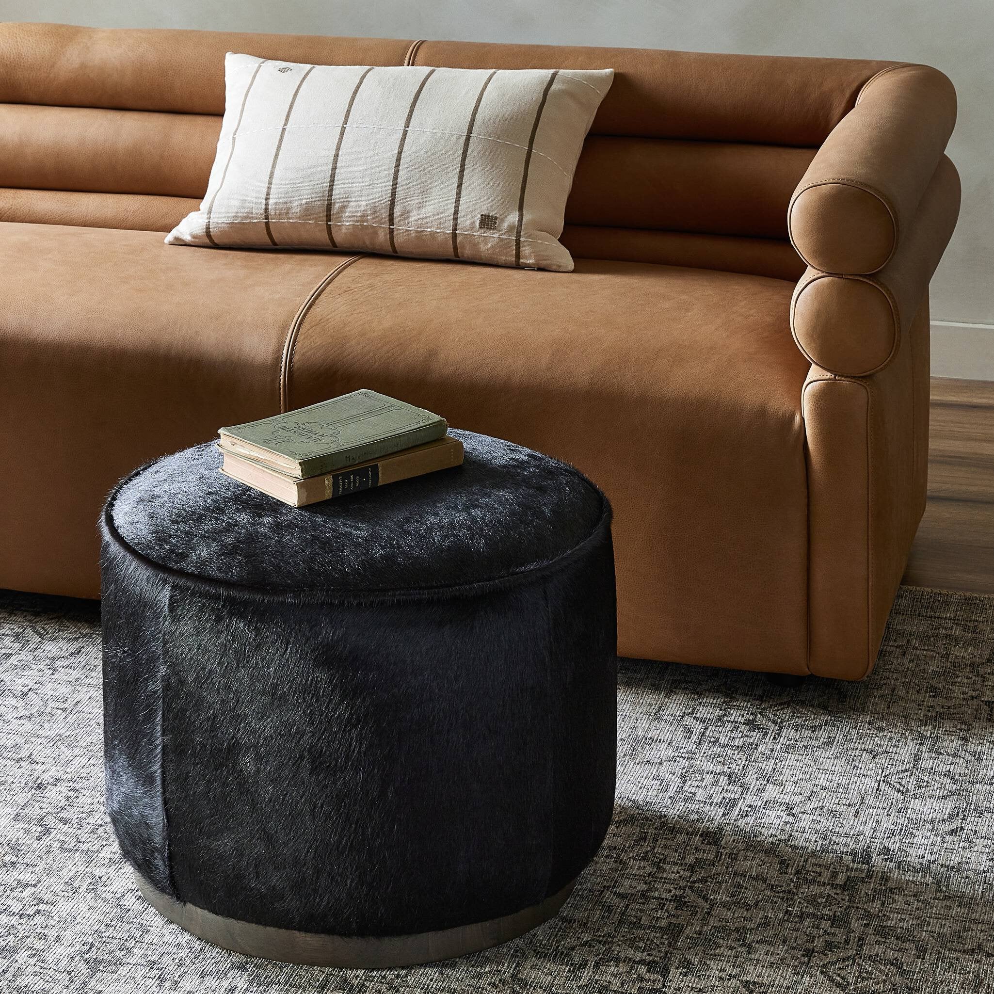 Four Hands Sinclair Round Ottoman — Dark Hair on Hide-Sienna Brown