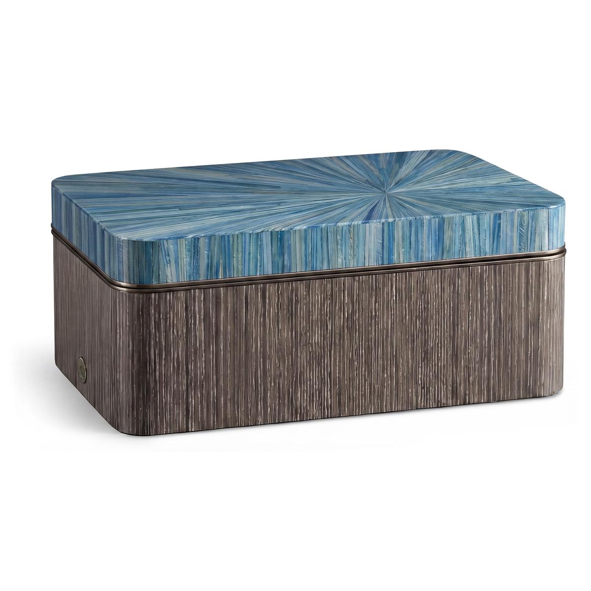Decorative box with blue patterned lid and wooden base on a white background