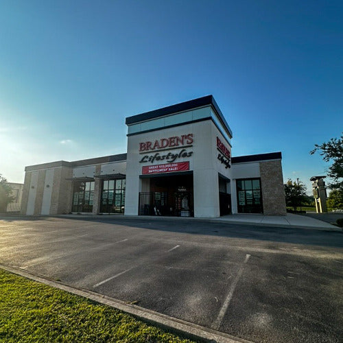 Storefront with 'Braden's Lifestyles' sign on a clear day