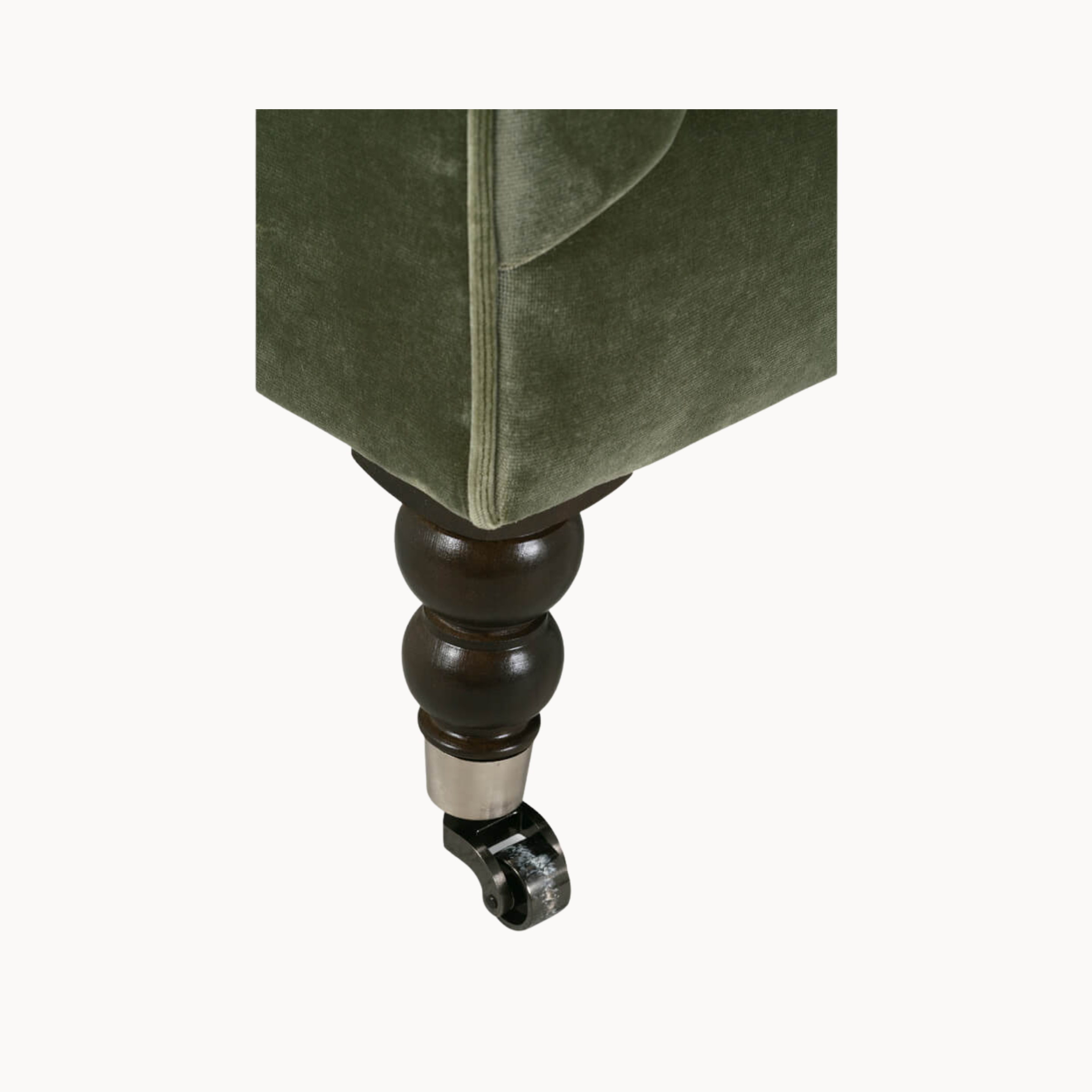 Deatiled view of sofa leg with casters