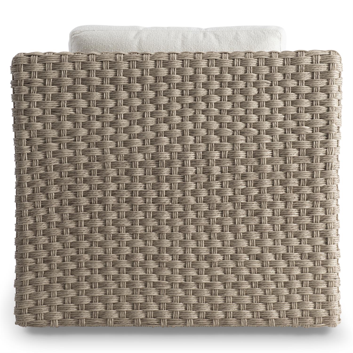 The rear view of an outdoor swivel chair showcasing its intricately woven all-weather wicker frame. The high backrest and plush cushion provide full support, while the sturdy construction ensures durability and long-lasting outdoor use