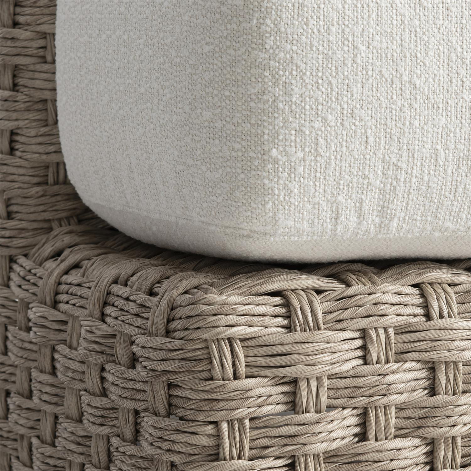 A close-up of the lounge chair’s plush seat cushion and intricately woven wicker frame. The thick, weather-resistant cushion ensures comfort, while the handwoven wicker showcases fine craftsmanship and durability.