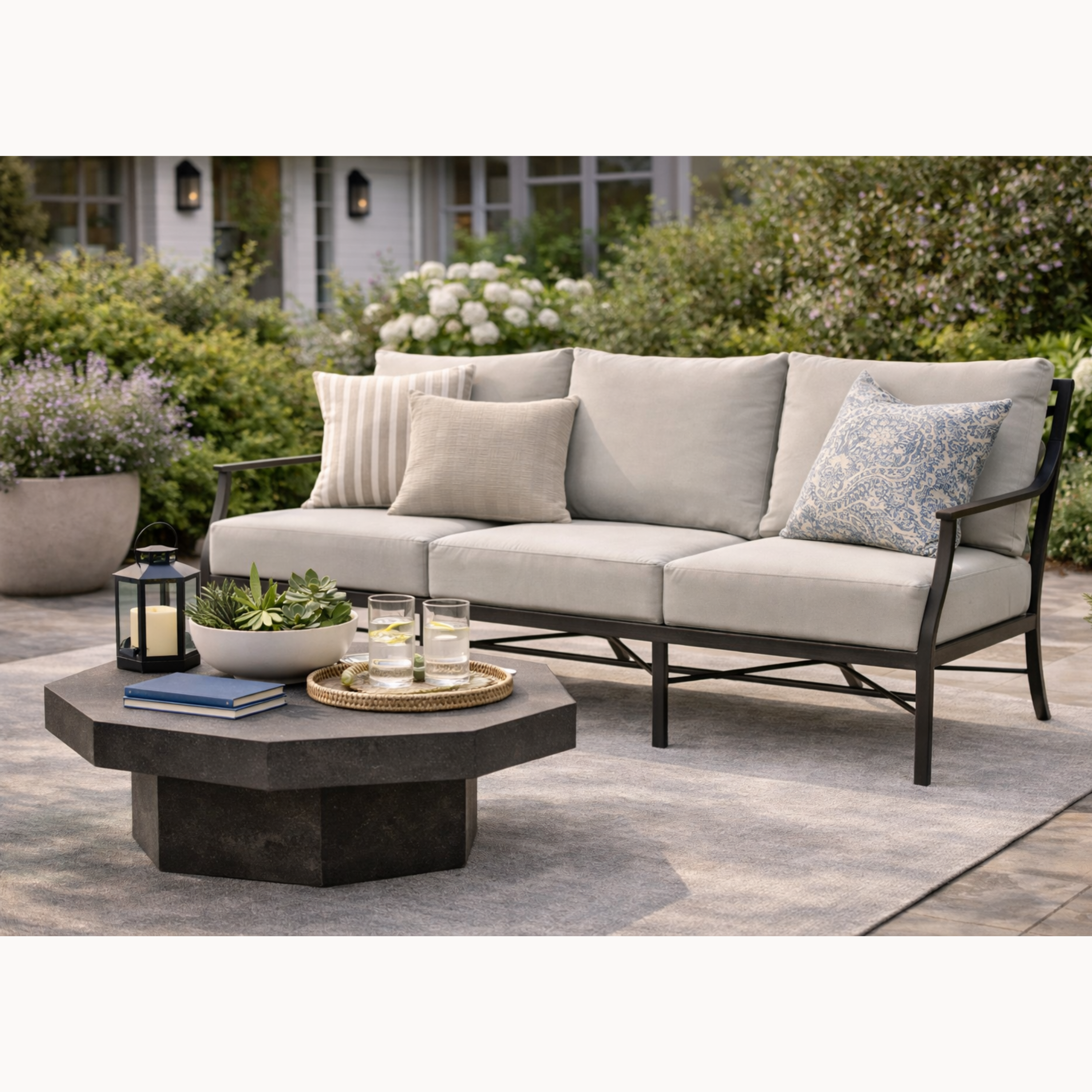 Outdoor patio set with a sofa and coffee table on a patio