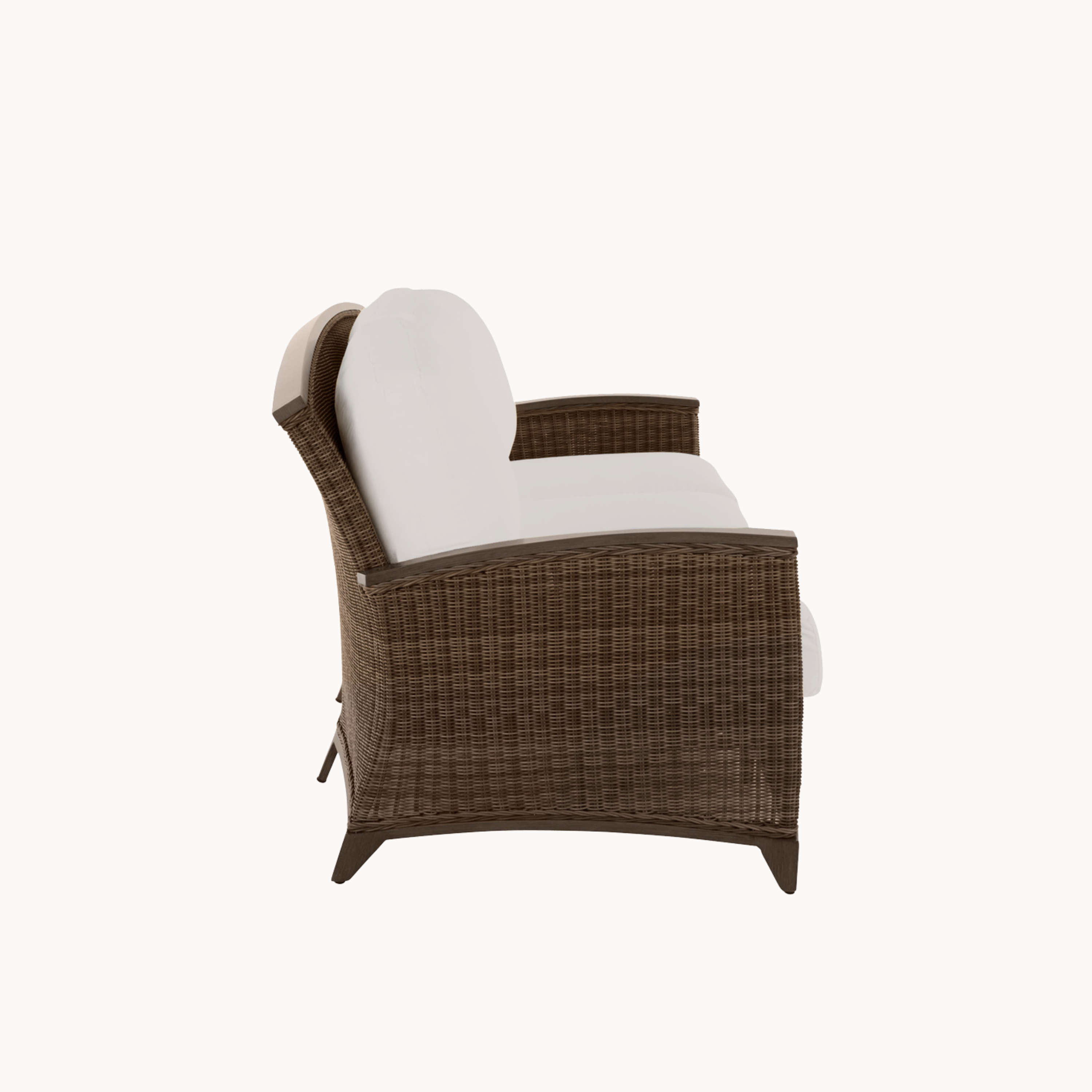 Brown wicker chair with white cushion on a white background
