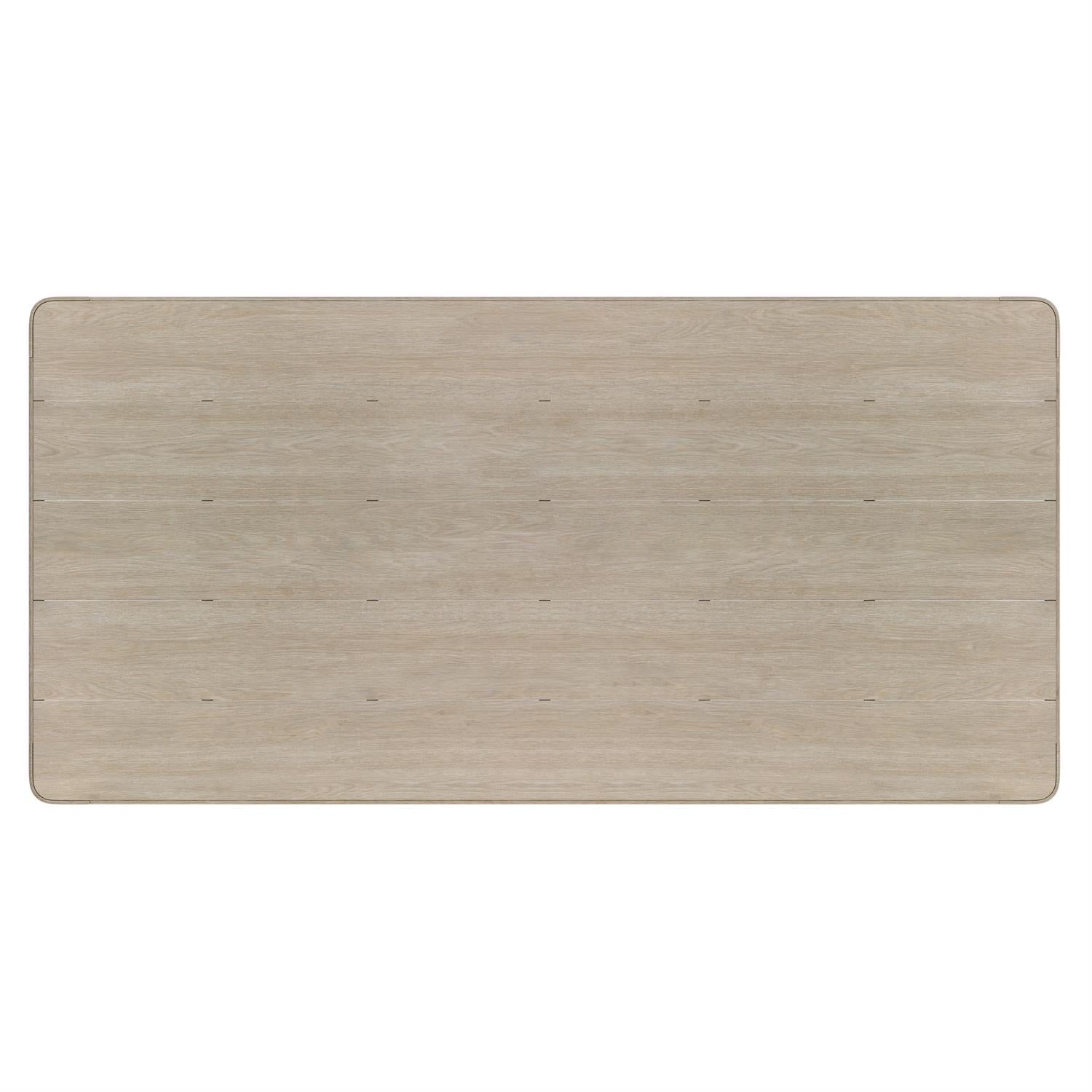 A close-up of the tabletop, highlighting the slatted teak design, softly rounded edges, and natural grain texture that enhance its organic, modern appeal.