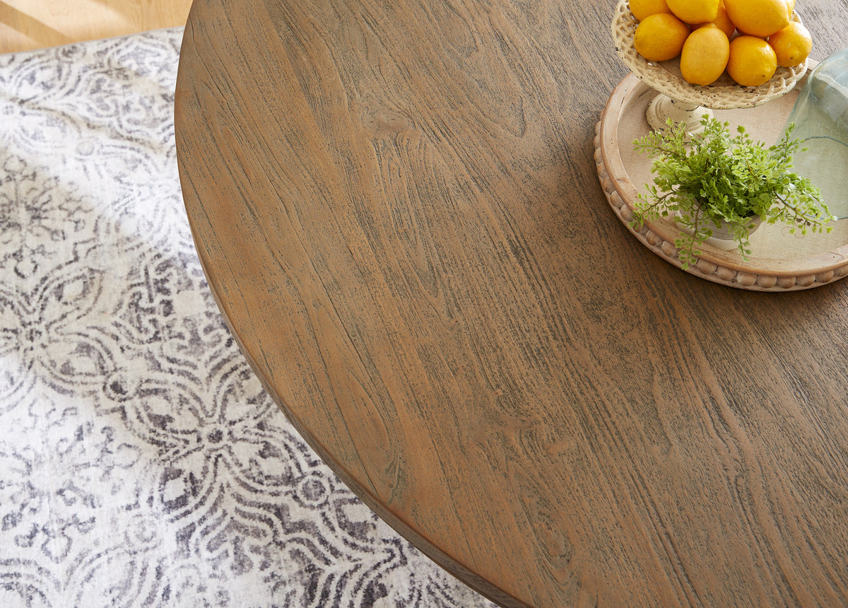 Close-up of the hand-finished mango wood grain on a Home Trends & Design dining table top