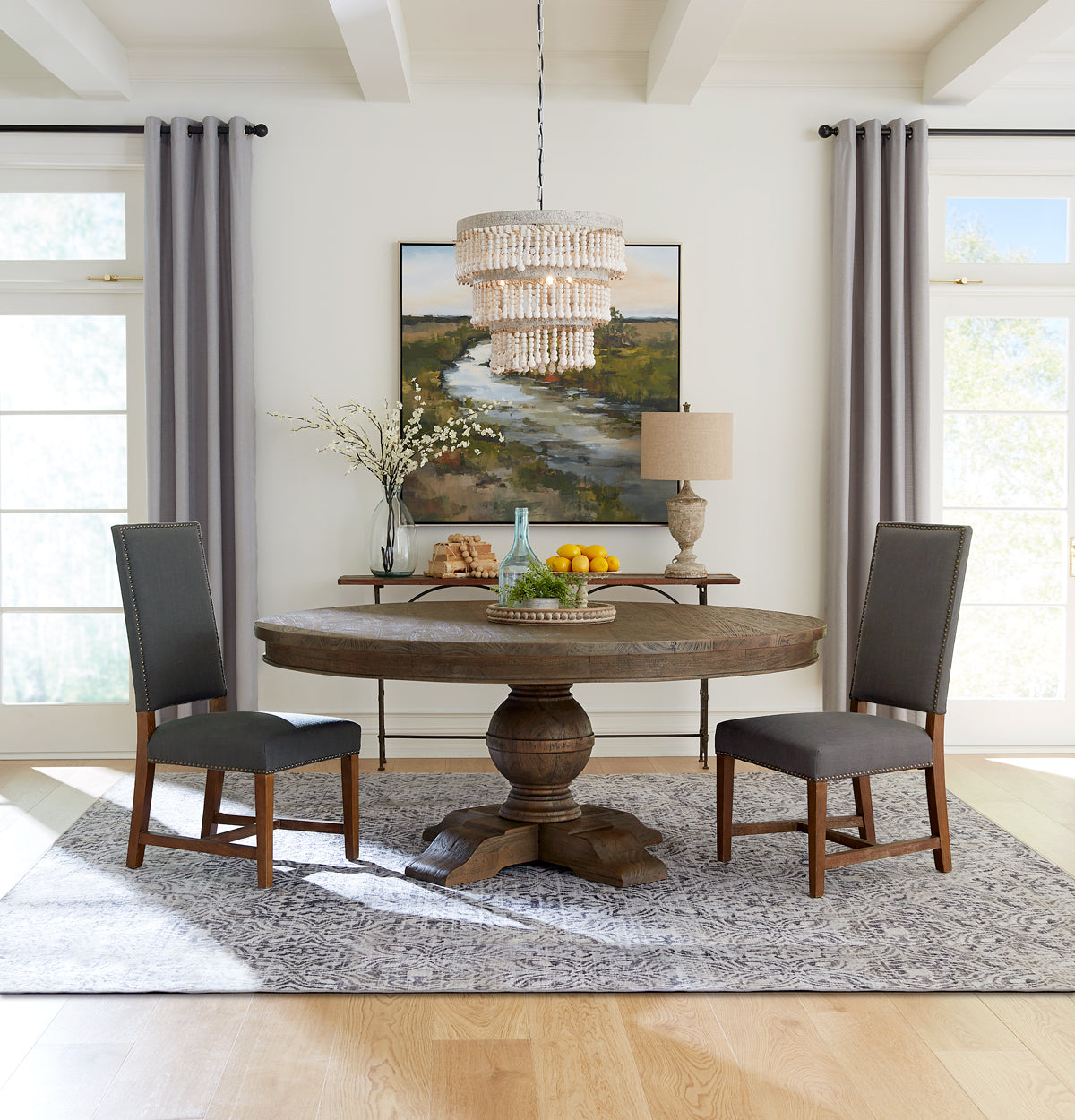 Home Trends & Design Colonial Plantation round pedestal dining table in a bright dining room