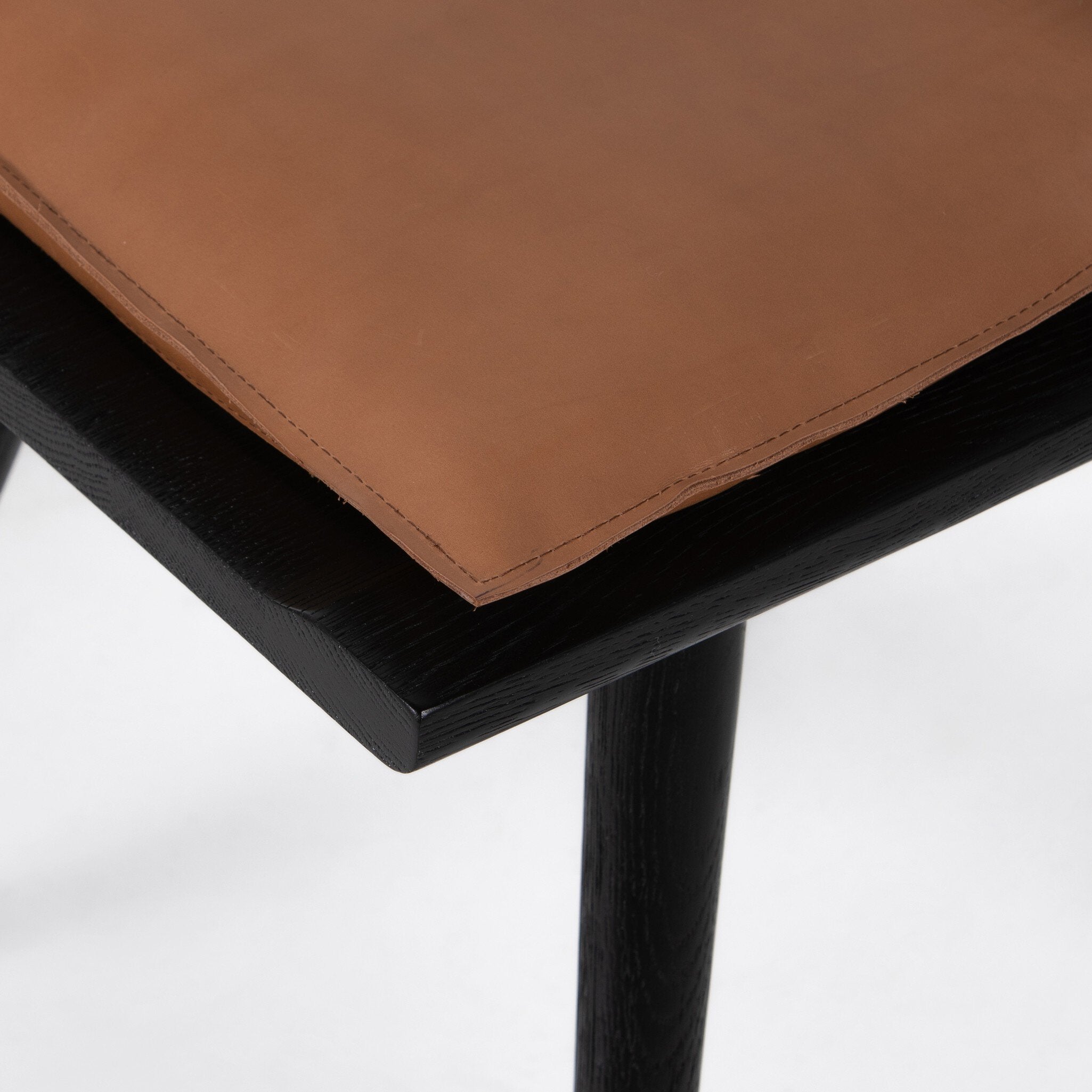 Four Hands Ripley Dining Chair — Black Oak-Whiskey Saddle-Ivory Backing