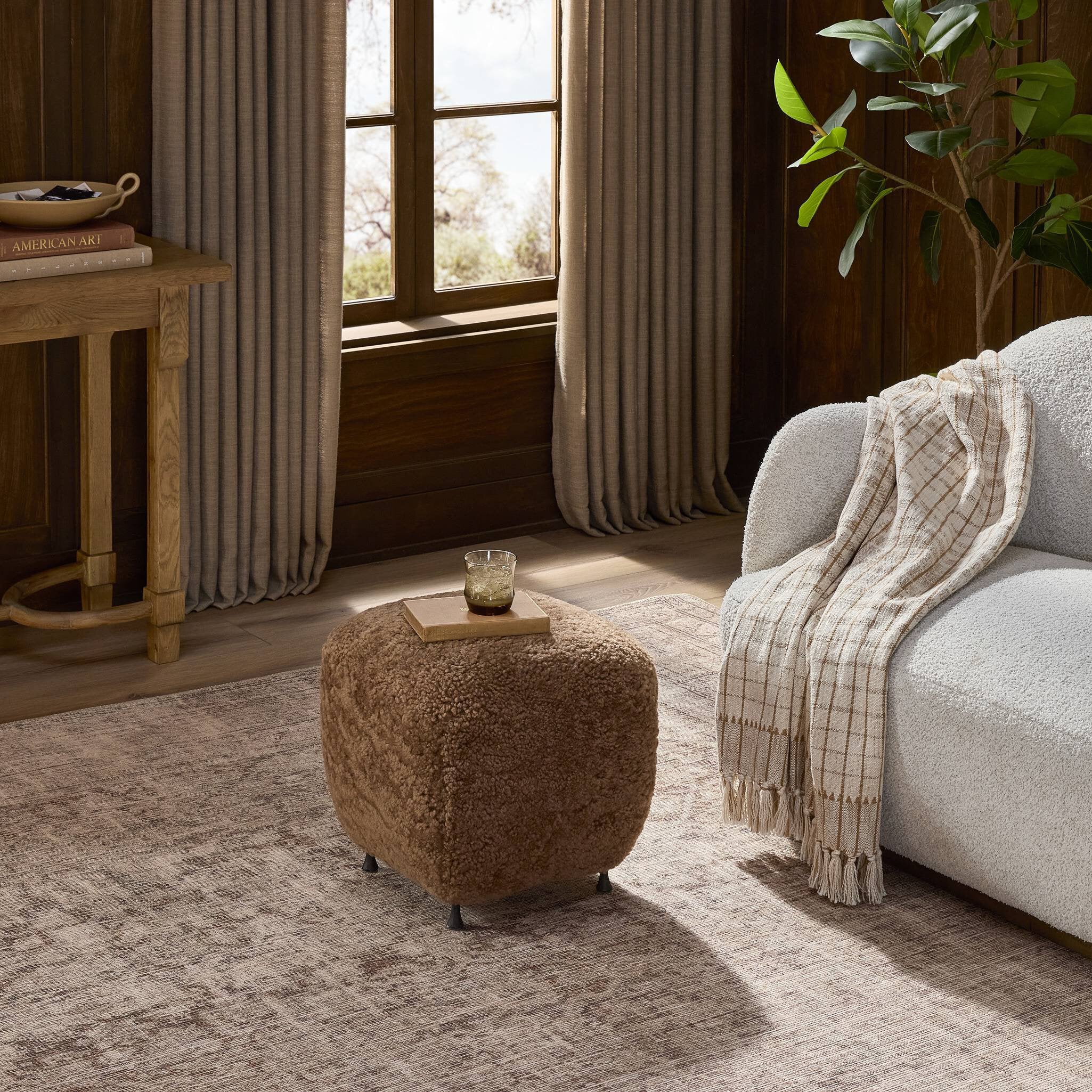 Four Hands Joey Ottoman — Amber Shearling-Hammered Black