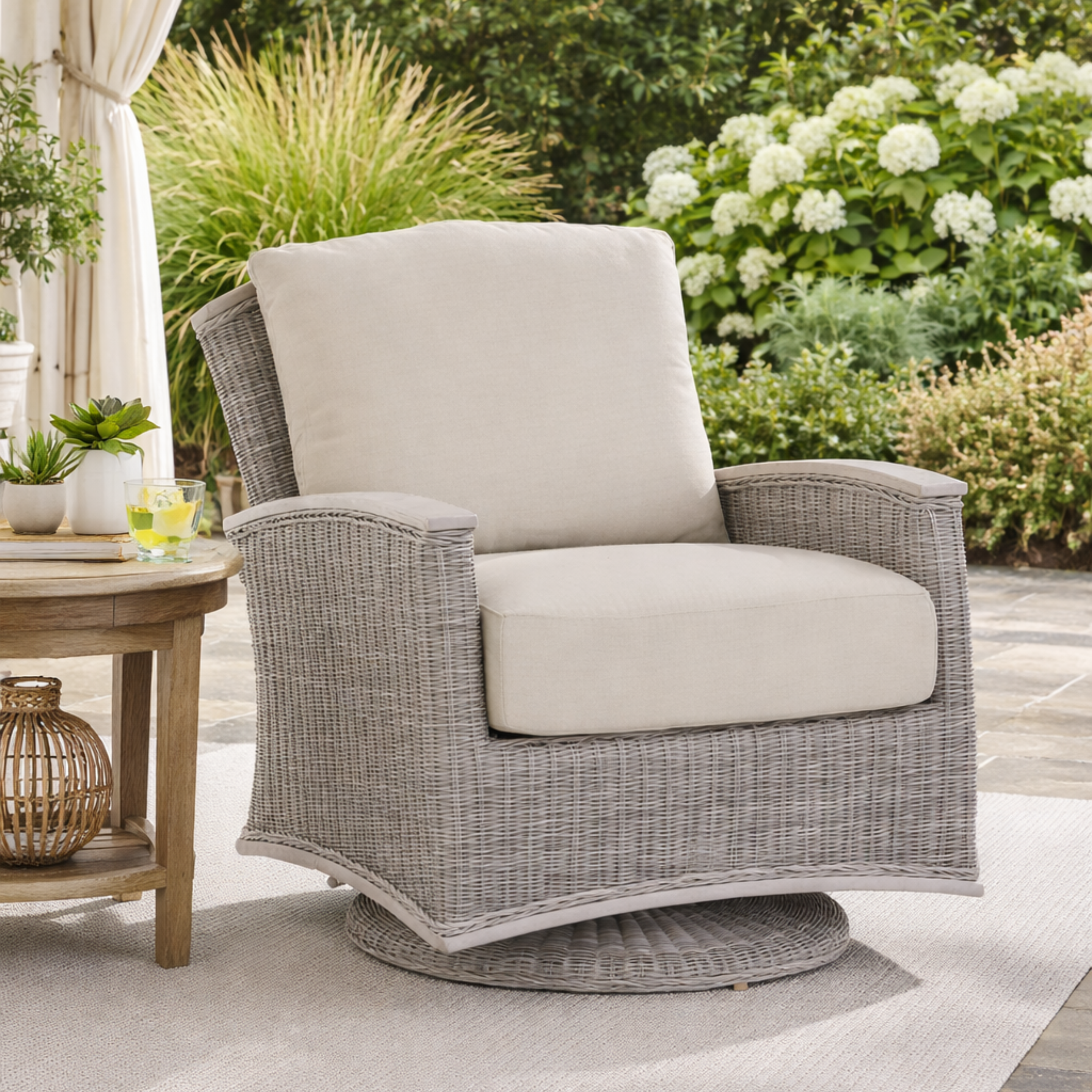 Gray wicker chair with beige cushions on a patio