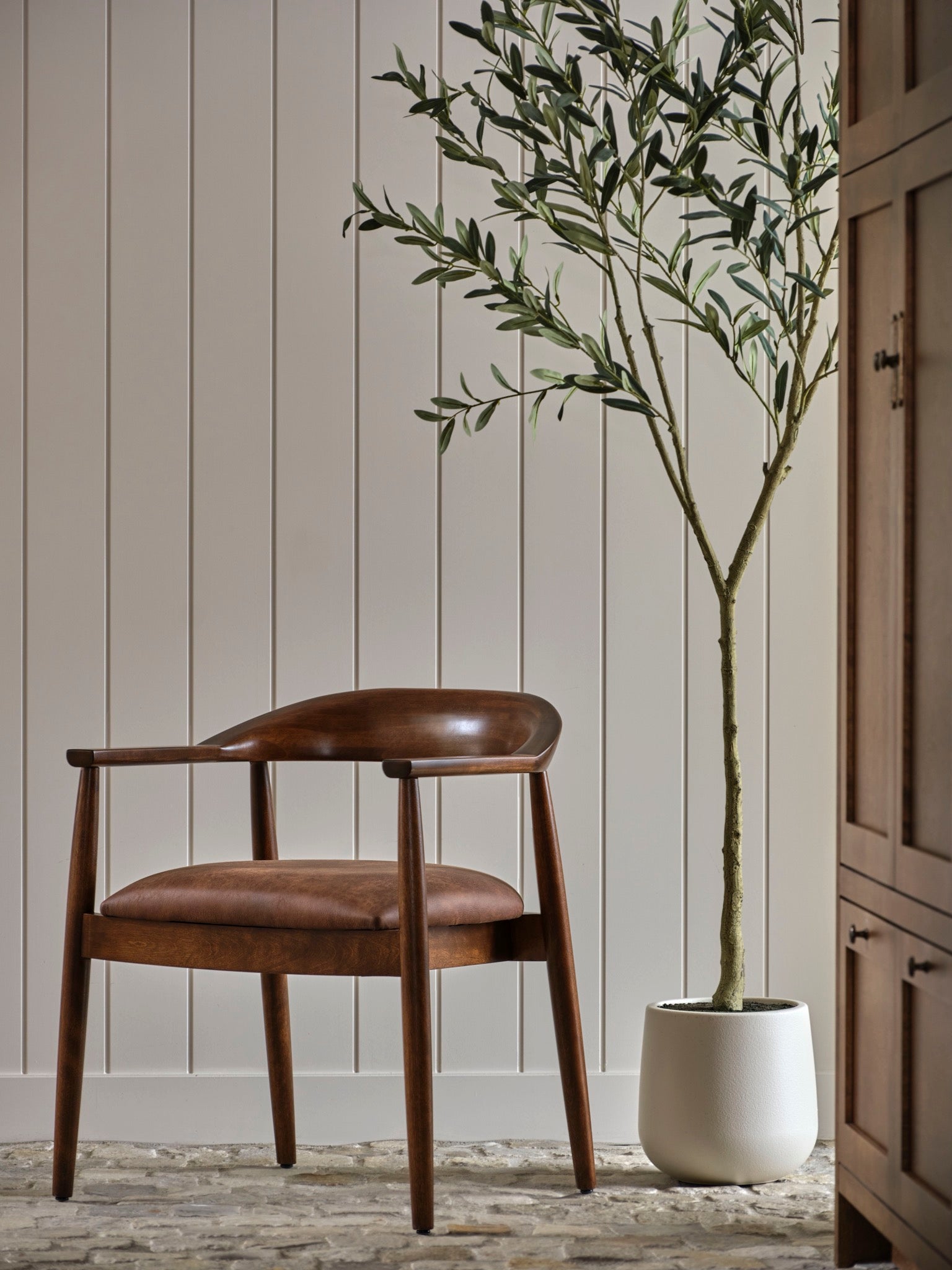 A custom-configured Canadel wood dining chair